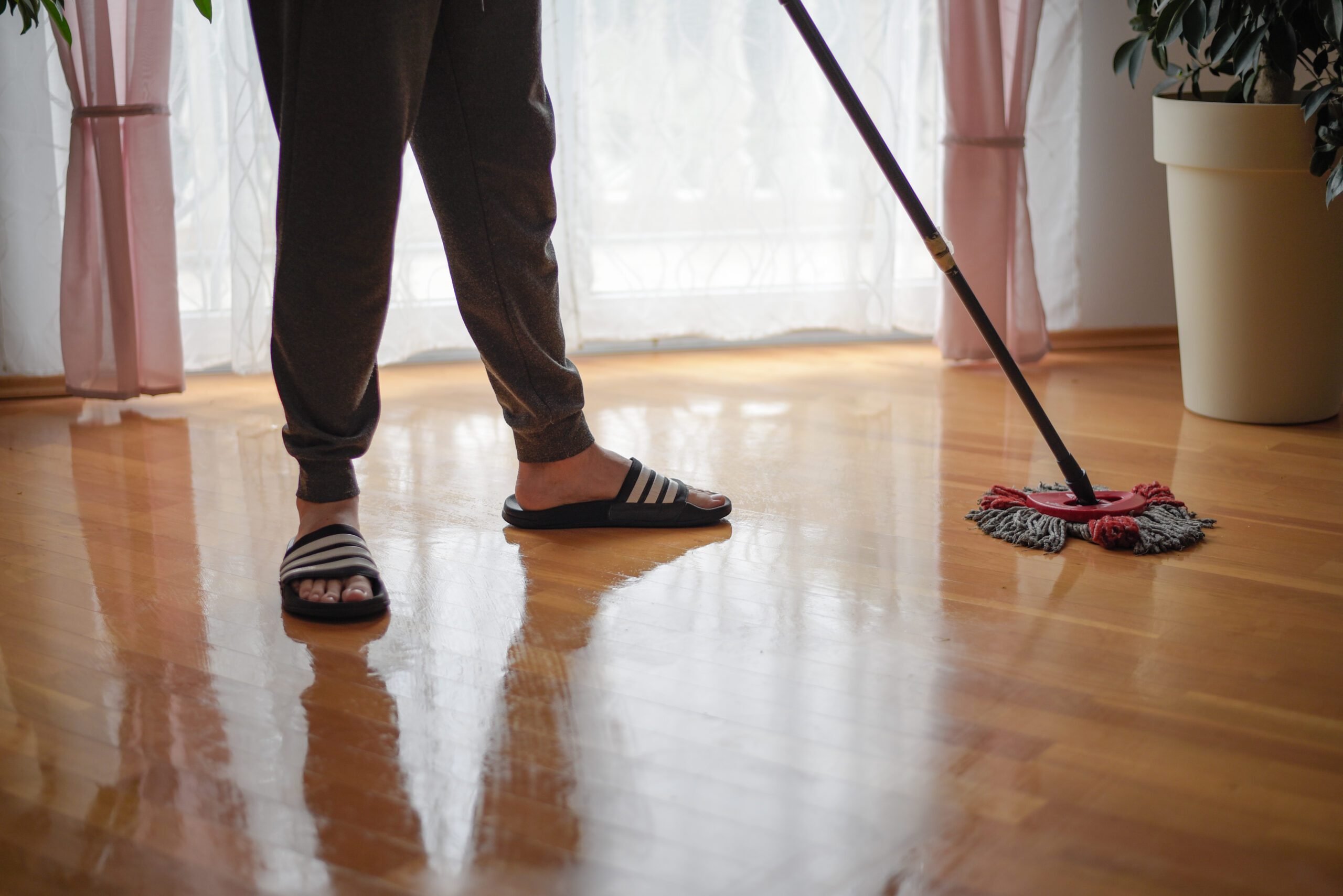 person cleaning interior floors