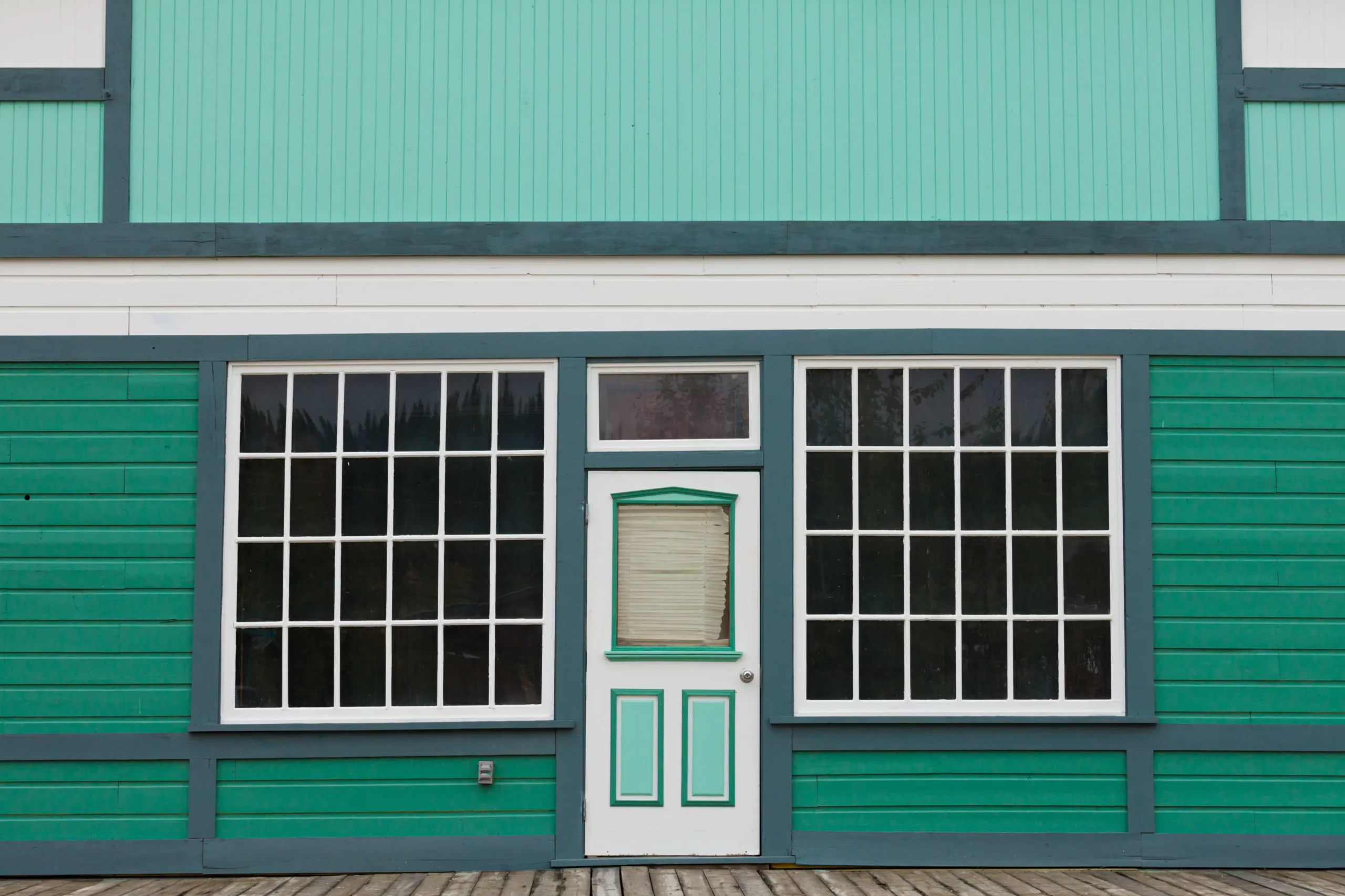 store front with green exterior paint