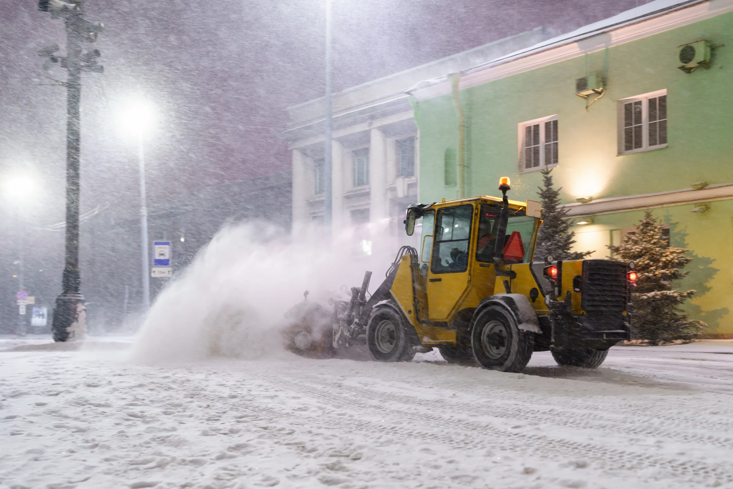 tractor sweeping snow